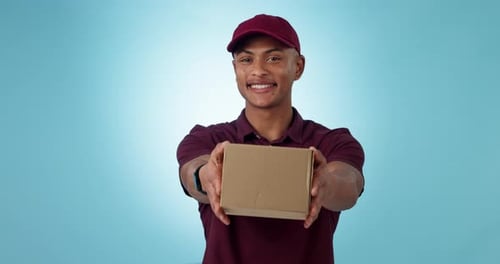 Delivery, studio and happy man giving box for logistics work, courier shipping