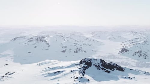 A Snowcovered Mountain Range with Majestic Peaks in the Distance