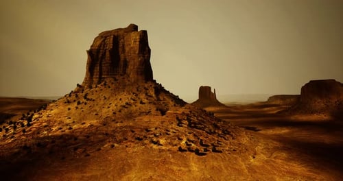 Vast Desert Landscape with Towering Rock Formations and Golden Terrain