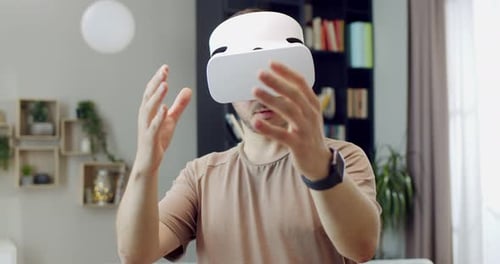 Man Using Virtual Reality Headset Indoors