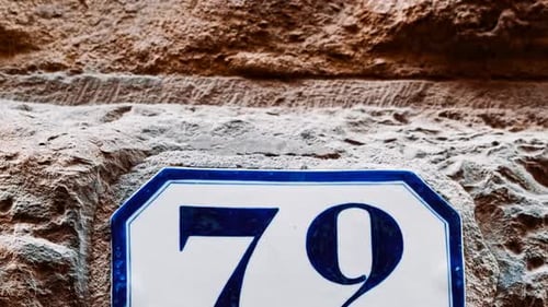 Number 72 (seventy-eight) Affixed to a Building