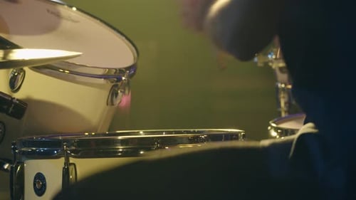 Jazz drummer plays drums and cymbals at music festival