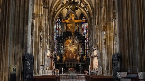 4K Moving down the main aisle towards the altar of St. Stephens Cathedral (Stephansdom), Vienna