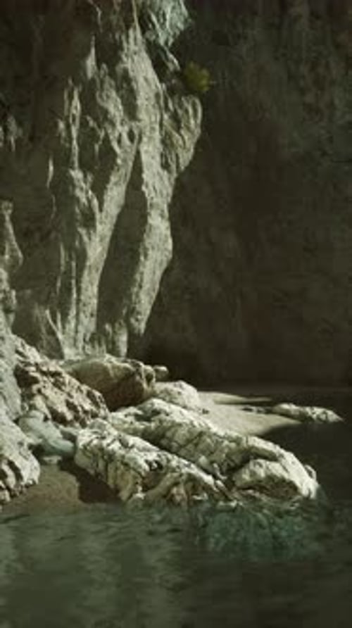 Rugged Cliffside By Calm Waters at Dusk