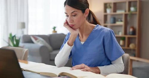 Woman Studying Medical Books at Home