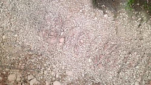Drone Ascending Over a Massive Pile of Bricks From a Destroyed Brick Pipe