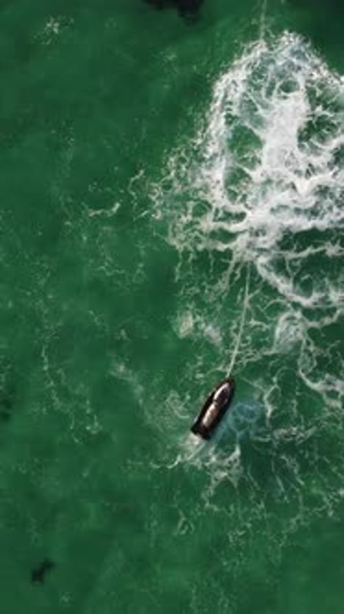 A Man Flies on a FlyBoard Aerial Top Down View Water Extreme Sport Azure Summer Sea with Outdoors