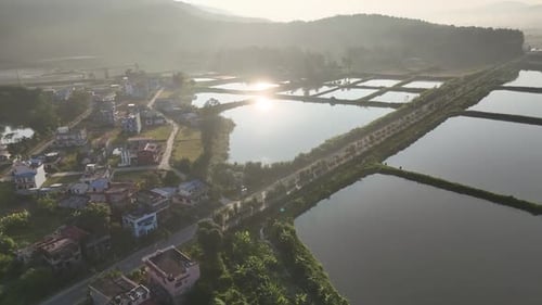 Aerial shot of village and terraced fish ponds