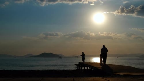 Fishing Person Silhouette By Nightfall Lake