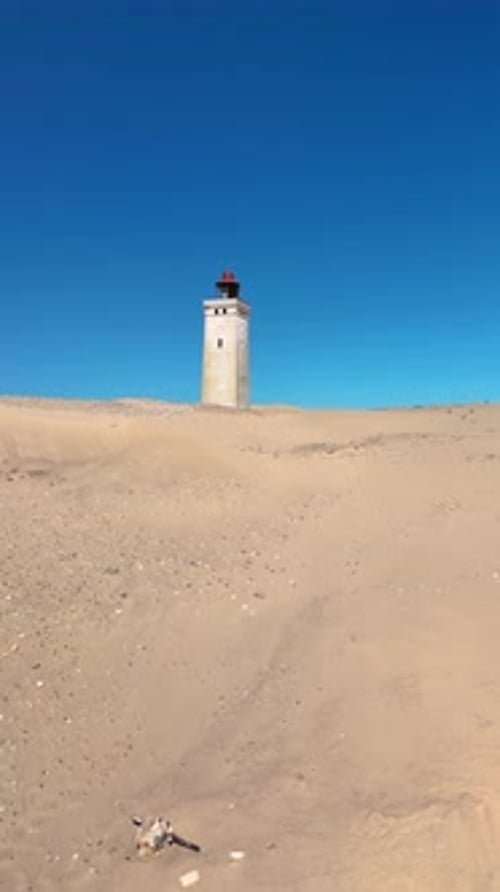Explorez le paisible phare de Rubjerg Knude Fyr dans le Jutland, au Danemark
