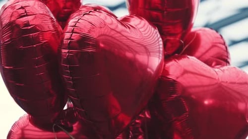 Bunch of Red Heart Balloons Floating in the Air