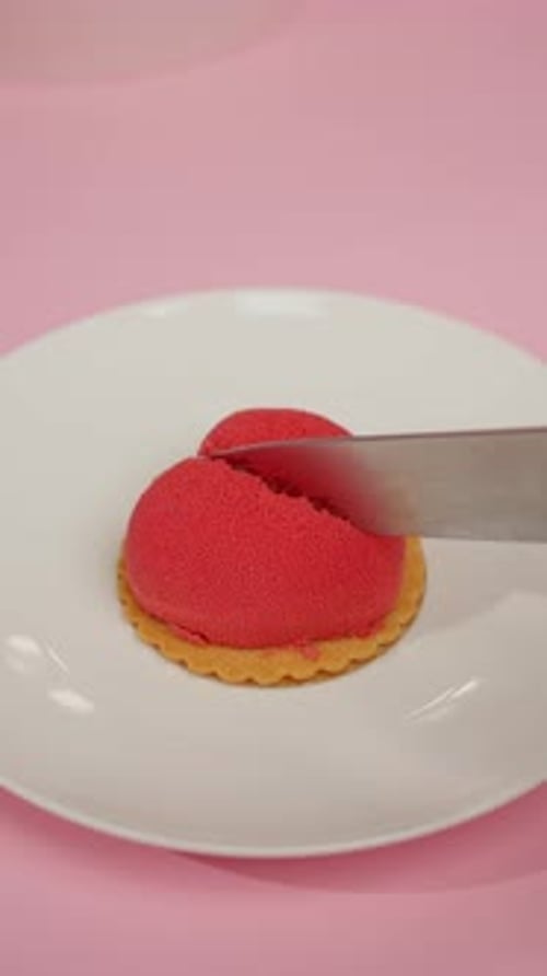 Heart Shaped Dessert Cut with Knife on Plate