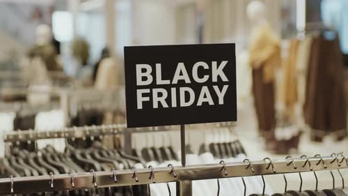 Black Friday Sign in Clothing Store during Discount Season