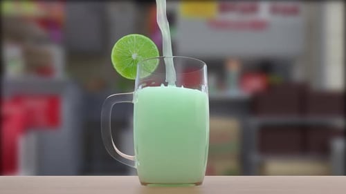 Fresh Lime Juice Fall in Glass