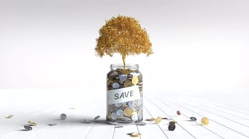 Coins in a glass jar with golden tree, Money saving concept