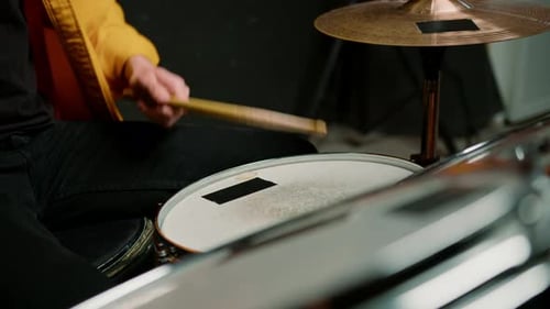 drummer plays a drum kit in a recording studio at a professional musician rehearsal recording a song
