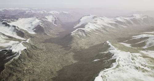 Stunning View of Snow Capped Mountains and a Rocky Valley in a Remote Landscape