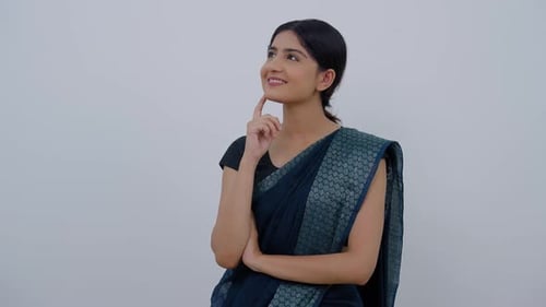 Woman in Sari Thinking and Smiling