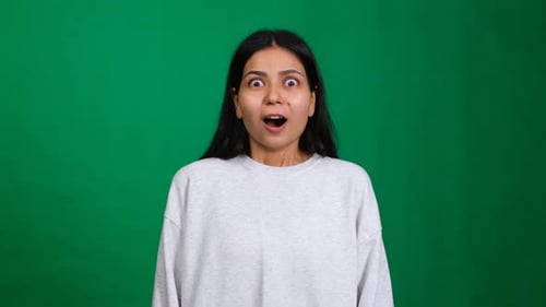 Surprised Woman Reacts on Green Screen Background