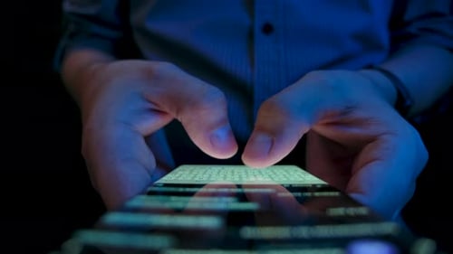 Young Man Texting on Smartphone