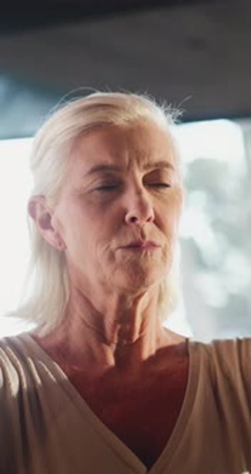 Calm Senior Woman Practicing Yoga Indoors, Close Up