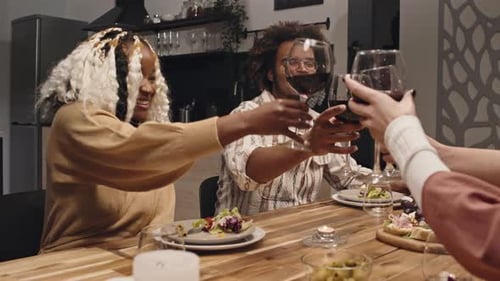 Friends Toasting with Wine at Dinner Party