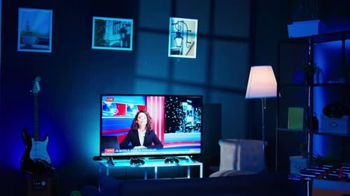 Streaming Equipment in Modern Apartment Illuminated with RGB Lights at Night