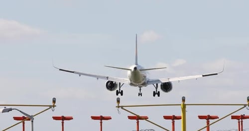 Plane lands at dusk