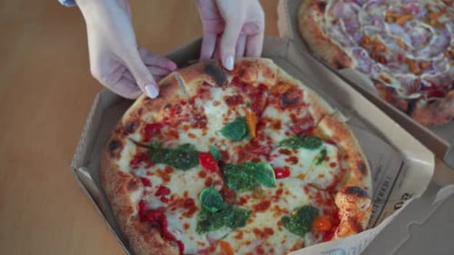 Fresh Pizza Being Removed From Delivery Box