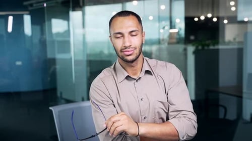 Smiling Young Adult in Modern Office Setting