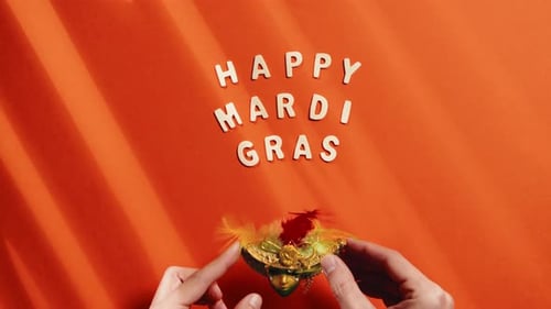 Mardi Gras Mask and Letter Blocks on Orange