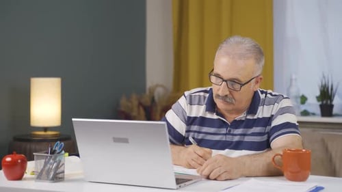 Home office worker old man freelancing.