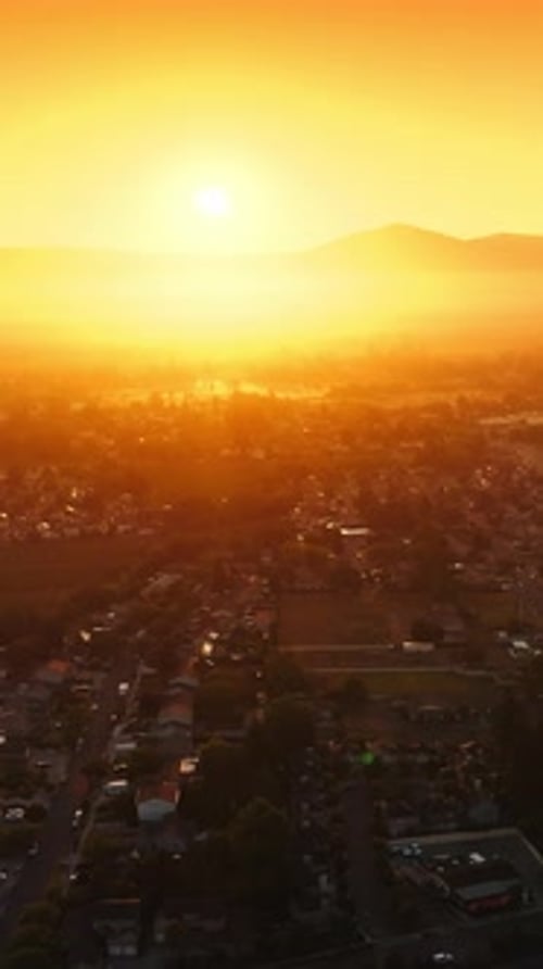 Sunlit panorama of Napa city, California, USA. Drone footage over the valley