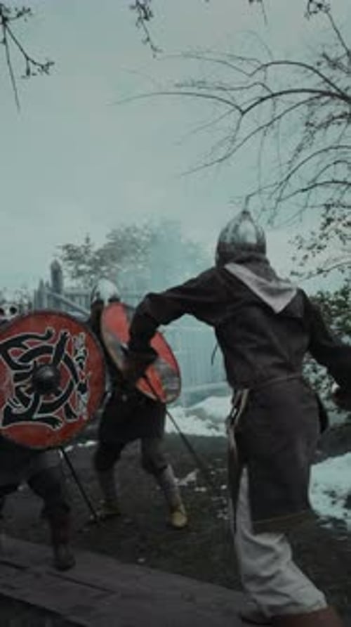 Men in Armor Fighting with Swords and Shields