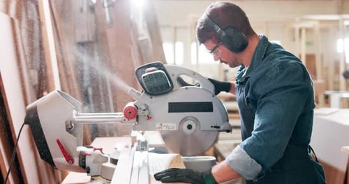 Machine, saw and man in workshop with wood project in carpentry and process of cutting plank