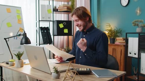 Focused Office Worker Man Working with Schedules Financial Graphics While Using Calculator Laptop