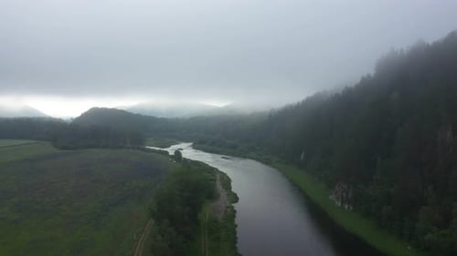 Hazy aerial view of river at Ural mountains. Beautiful Agidel river