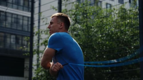 Athletic Adult Man Skipping Rope at Outdoor Facility
