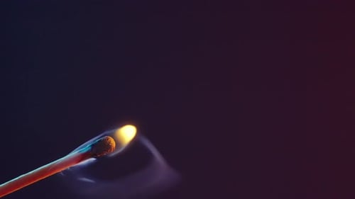 The Match Lights Up and Burns with a Yellow Flame