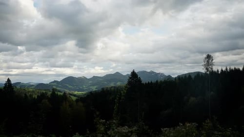 Beautiful view with mountains in the back and a clouded sky