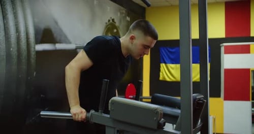 Man Exercising on Parallel Bars