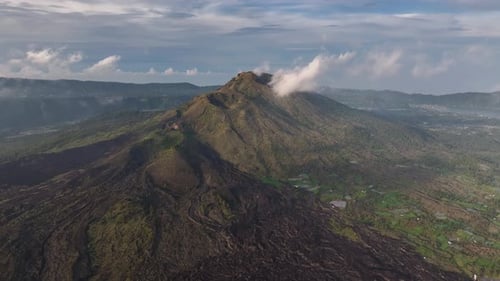 Aerial scenery of Mount Batur in North Bali. Volcanic landscape during evening. Travel destination
