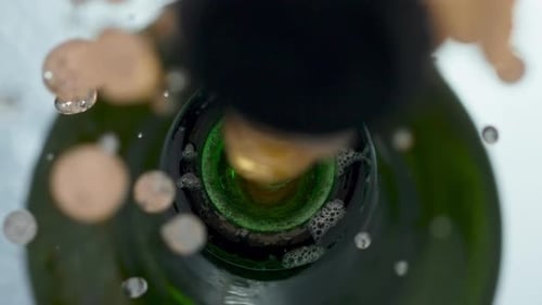 Lager Bottle Cap Popping Off Closeup. Golden Carbonated Beer Splashing Slow Motion. Opening Craft...