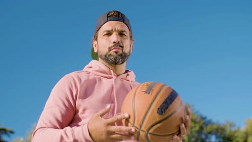 Bottom Shot of Basketball Player Throwing Ball
