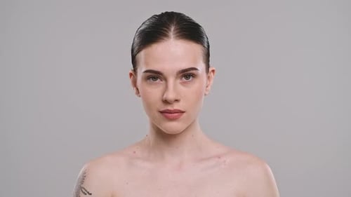 Woman Poses with Bare Shoulders in Studio