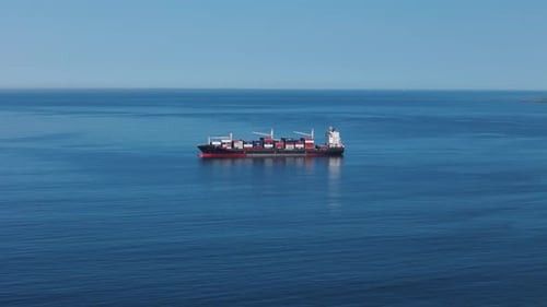 Cargo Ship Navigating the Deep Blue Ocean for Global Trade