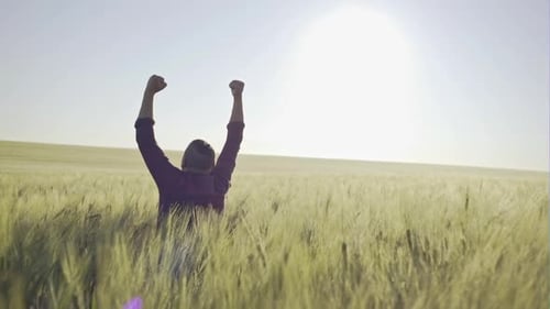 Happy Farmer on the Field of Young Wheat on the Background of the Sunrise Thank God for a Good