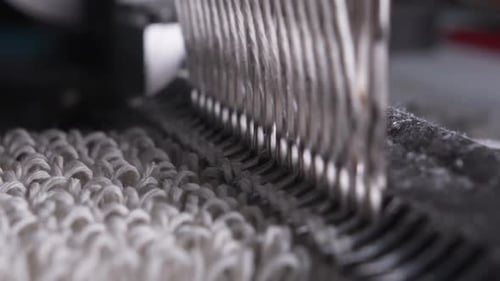 Closeup of Weaving Mechanism is Fabricating Synetic MOP