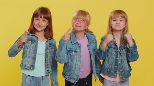 Cheerful Children Counting and Gesturing on Yellow Background
