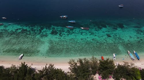 Boats On The Shore In A Beach In Bali, Indonesia - aerial drone shot